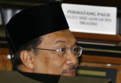 Malaysia opposition leader Anwar Ibrahim gestures during a swearing in ceremony at Parliament House in Kuala Lumpur on August 28, 2008. Anwar Ibrahim will return to parliment after a ten year absence after winning a hotly contested by-election in northern Penang state tthat now will make him the parliamentary Leader of The Opposition. Anwar claimed a landslide victory this week in a by-election to return him to parliament, capping a stunning comeback after he was sacked as deputy premier in 1998 and jailed for sodomy and corruption.