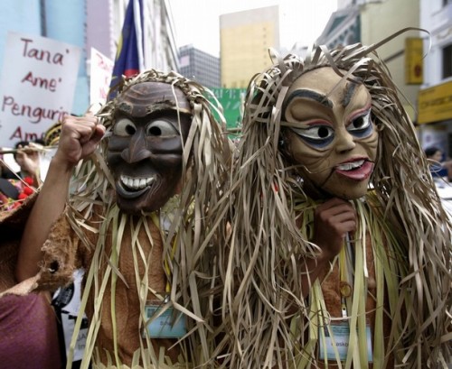 Malaysia's indigenous people wear masks as they gather during a demonstration to call for the government to implement the individual and collective rights of indigenous people, in Kuala Lumpur September 13, 2008.