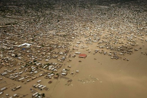 This handout photo received on September 5, 2008 courtesy of the Red Cross Red Crescent National Society shows an aerial view of the flooding caused by Hurricane Hanna in Gonaives, Haiti's second largest city (pop. 300000). On September 1, Hurricane Hanna closed in on south-eastern Bahamas and the Turks and Caicos Islands. On September 2, the hurricane was downgraded to a Tropical Storm but has nevertheless dumped heavy rains in Haiti and Bahamas. The Haitian provinces of Antibonite and Nord-Ouest are completely flooded and latest reports indicate the deaths of ten people. A Red Cross Red Crescent Field Assessment Coordination Team (FACT) including members from the Partner Red Cross National Societies from Germany, Finland, Norway, United States and Switzerland has been alerted for deployment to Haiti. The team was expected to arrive in Haiti on September 3. There is also a Red Cross Red Crescent Emergency Response Unit (ERU) alert and a Regional Intervention Team (RIT) alert for Haiti.