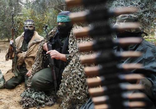 Hamas militants receive instructions after a training drill near the border with the Gaza Strip December 19, 2008. Hamas on Thursday declared an end to a six-month-old Egyptian-brokered ceasefire with Israel in the Gaza Strip, raising the prospect of an escalation in cross-border fighting. REUTERS