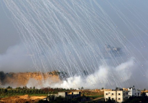 A weapons system fired by Israeli forces lands in the northern Gaza Strip January 9, 2009. Israel pushed ahead with its two-week-old offensive in the Gaza Strip, ignoring a U.N. Security Council resolution calling for an immediate ceasefire. REUTERS/Yannis Behrakis (GAZA)