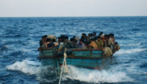 Rohingya migrants are seen in a boat being pulled out to sea off of Koh Sai Daeng in southwest Thailand in this undated photo obtained by CNN. Pressure mounted on Thailand on January 26, 2009 to come clean on allegations the army towed Rohingya refugees out to sea and abandoned them in engine-less boats, after CNN showed pictures depicting exactly that.  REUTERS/CNN  (THAILAND)  MANDATORY CREDIT.  NO SALES. NO ARCHIVES. FOR EDITORIAL USE ONLY. NOT FOR SALE FOR MARKETING OR ADVERTISING CAMPAIGNS.